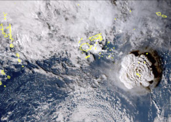 In this satellite image taken by Himawari-8, a Japanese weather satellite, and released by the agency, shows an undersea volcano eruption at the Pacific nation of Tonga Saturday, Jan. 15, 2022. An undersea volcano erupted in spectacular fashion near the Pacific nation of Tonga on Saturday, sending large waves crashing across the shore and people rushing to higher ground. (Japan Meteorology Agency via AP)