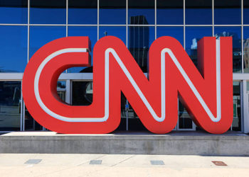 Atlanta, USA - October 19, 2011: Located in downtown Atlanta, Georgia next to Centennial Olympic Park, the CNN Center is the world headquarters of the Cable News Network (CNN). The building houses several newsrooms and studios for CNN's news channels along with this large CNN logo.