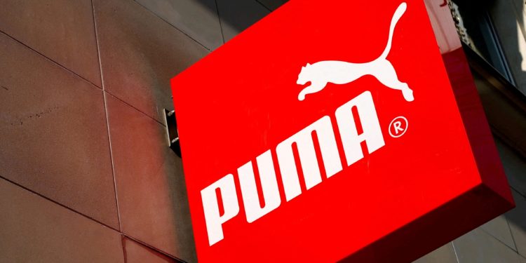 FILE PHOTO: The logo of German sports goods firm Puma is seen at the entrance of one of its stores in Vienna, Austria, March 18, 2016.   REUTERS/Leonhard Foeger/File Photo