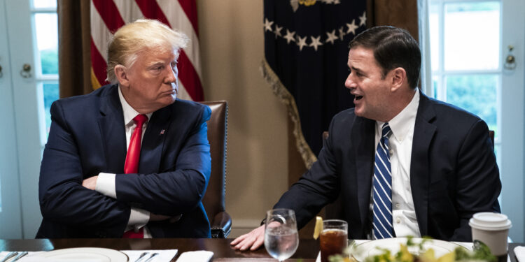 President Donald Trump speaks with Arizona Gov. Doug Ducey (R) as they participate in a working lunch with governors at the White House on June 13, 2019. MUST CREDIT: Washington Post photo by Jabin Botsford.