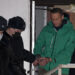 TOPSHOT - Opposition leader Alexei Navalny is escorted out of a police station on January 18, 2021, in Khimki, outside Moscow, following the court ruling that ordered him jailed for 30 days. - Kremlin critic Alexei Navalny on Monday urged Russians to stage mass anti-government protests during a court hearing after his arrest on arrival in Moscow from Germany. (Photo by Alexander NEMENOV / AFP) (Photo by ALEXANDER NEMENOV/AFP via Getty Images)