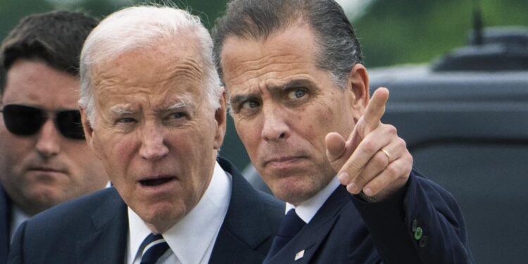 President Joe Biden talks with his son Hunter Biden as he arrives Delaware Air National Guard Base in New Castle, Del., Tuesday, June 11, 2024. (AP Photo/Manuel Balce Ceneta)