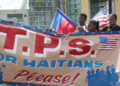 MIAMI, FL - MAY 13:  People protest the possibility that the Trump administration may overturn the Temporary Protected Status for Haitians in front of the U.S. Citizenship and Immigration Services office on May 13, 2017 in Miami, Florida.  50,000 Haitians have been eligible for TPS and now the Trump administration has until May 23 to make a decision on extending TPS for Haitians or allowing it to expire on July 22 which would mean possibly deportation for the current TPS holders.  (Photo by Joe Raedle/Getty Images)