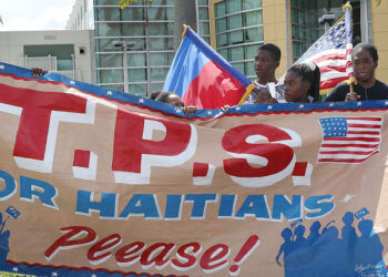 MIAMI, FL - MAY 13:  People protest the possibility that the Trump administration may overturn the Temporary Protected Status for Haitians in front of the U.S. Citizenship and Immigration Services office on May 13, 2017 in Miami, Florida.  50,000 Haitians have been eligible for TPS and now the Trump administration has until May 23 to make a decision on extending TPS for Haitians or allowing it to expire on July 22 which would mean possibly deportation for the current TPS holders.  (Photo by Joe Raedle/Getty Images)