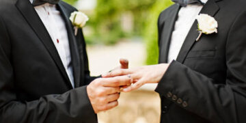 Gay Couple Exchanging Rings at Wedding