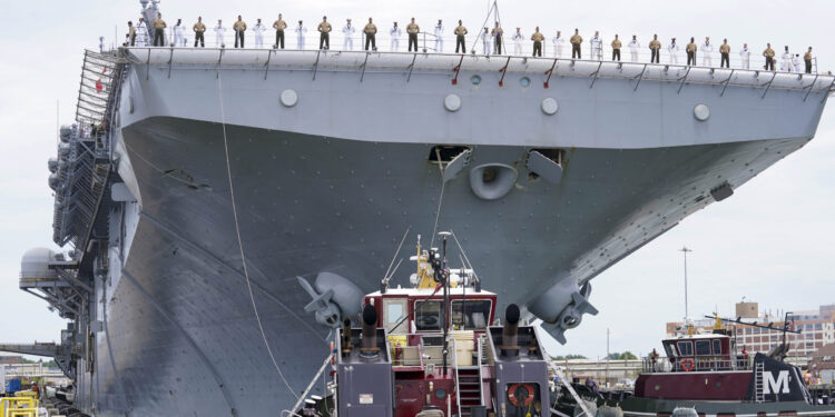 NORFOLK, Va. (Aug. 14, 2025) - Sailors and Marines man the rails aboard the Wasp-class amphibious assault ship USS Iwo Jima (LHD 7) as it departs Naval Station Norfolk for a regularly scheduled deployment. Sailors and Marines of the Iwo Jima Amphibious Ready Group (IWO ARG) - 22nd Marine Expeditionary Unit (MEU) Special Operations Capable (SOC) departed Norfolk and Camp Lejeune, North Carolina after completing a comprehensive, nine-month training program. (U.S. Navy photo by Mass Communication Specialist 1st Class Clay Whaley)